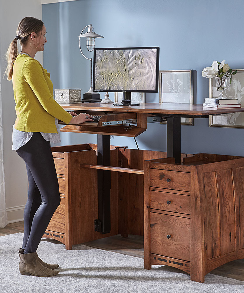Solid wood adjustable standing desk with file storage in home office