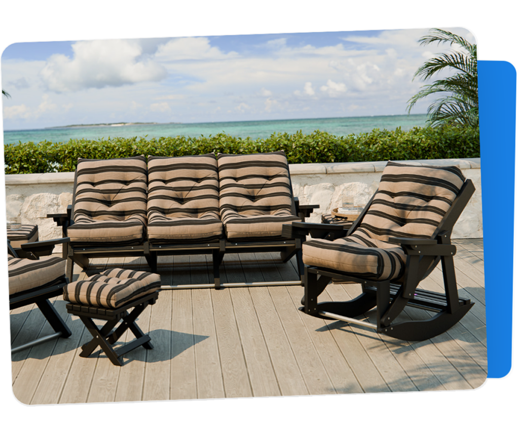 Outdoor poly patio furniture with striped cushions on oceanfront deck